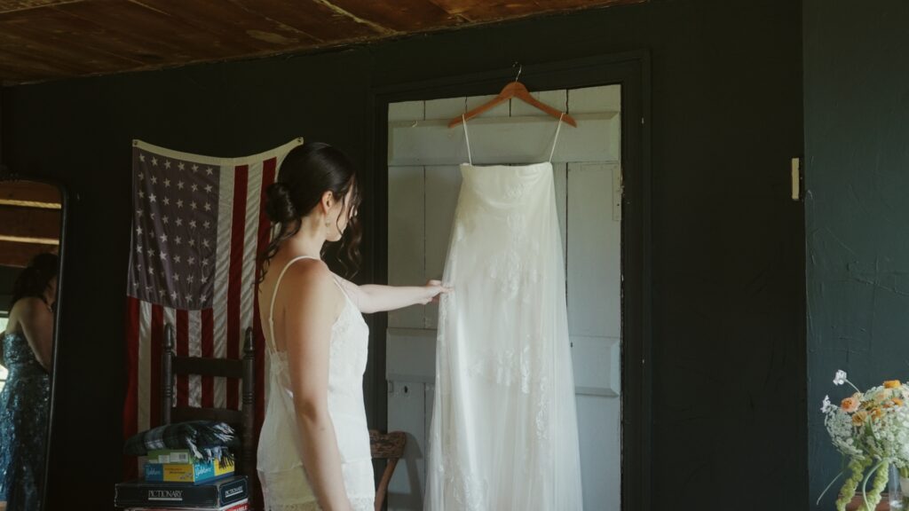 Hudson Valley bride admiring her Danielle Frankel wedding dress.