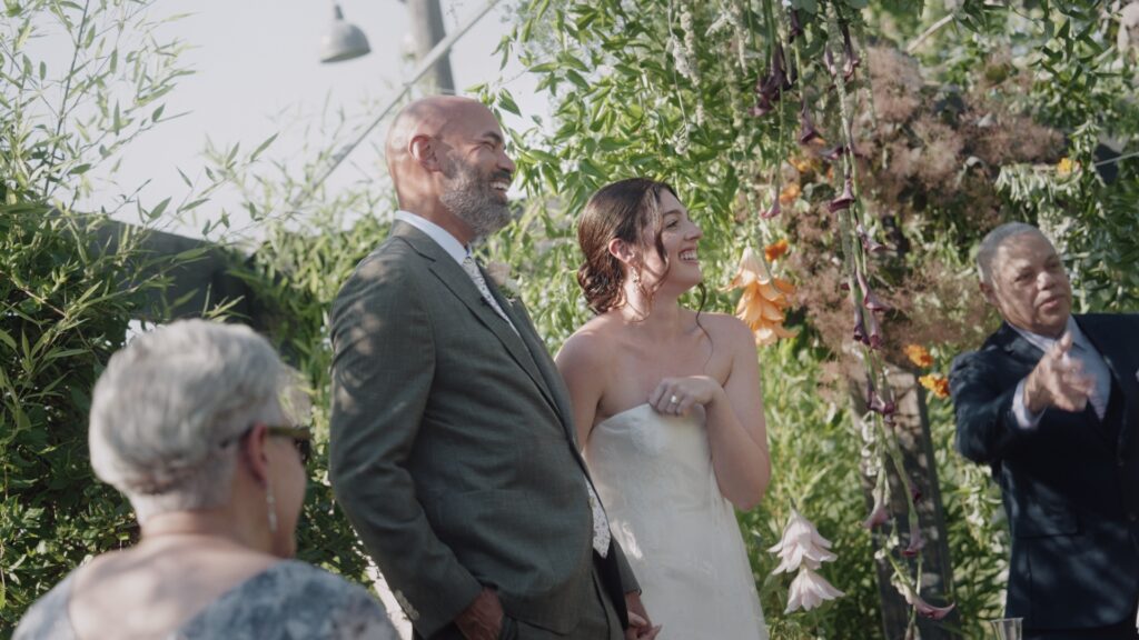 Couple Laughing during their wedding ceremoney at Audrey's Farmhouse in the Hudson Valley